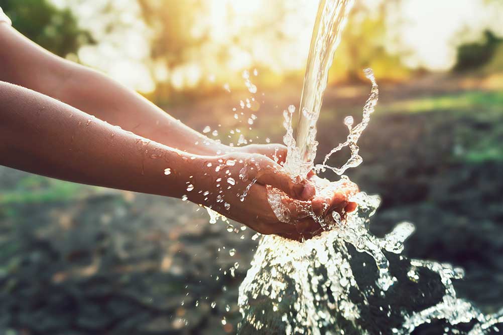 Hands rinsing under running water