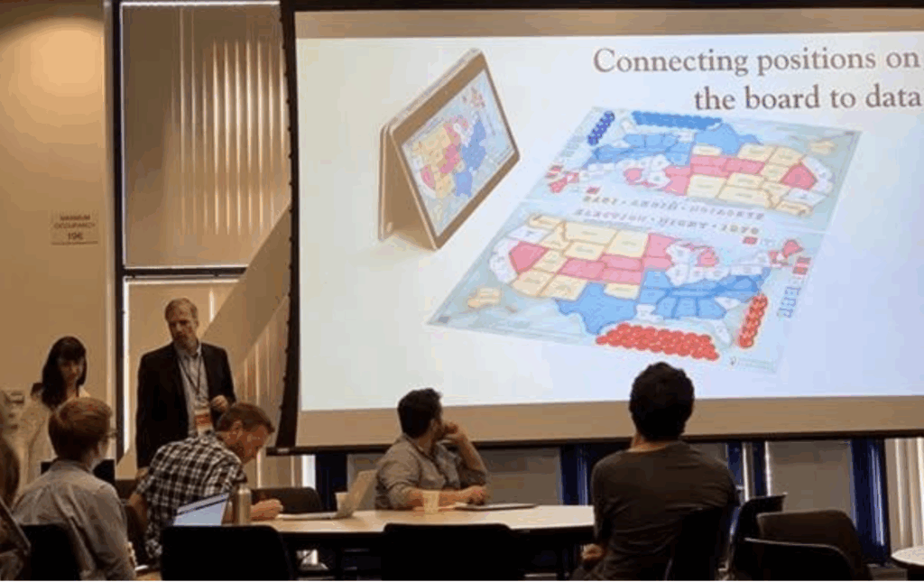 Dr. Jasminka Criley and Stuart Criley presenting Election Lab to classroom attendees.