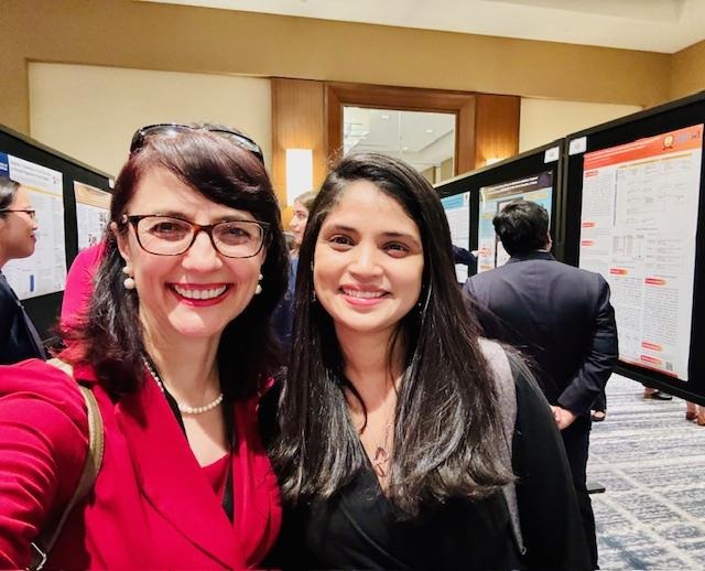 Dr Criley and Dr Rohini (President of AMSA – American Medical Student Association) at the conference poster sessions, giving feedback to presenters and continuing to mentor with insights and advice. 